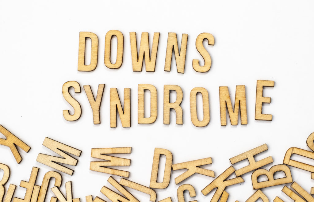 Downs syndrome word spelled out in wooden letters