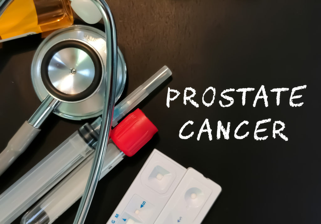 Prostate Cancer word on back background with medical tools. mens cancer