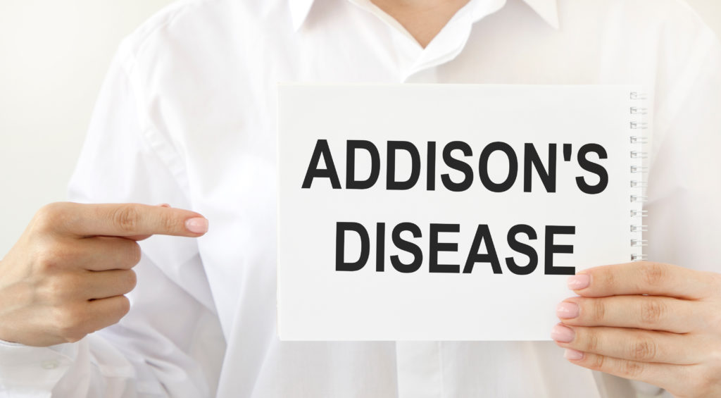  ADDISON'S DISEASE sign being held by female doctor