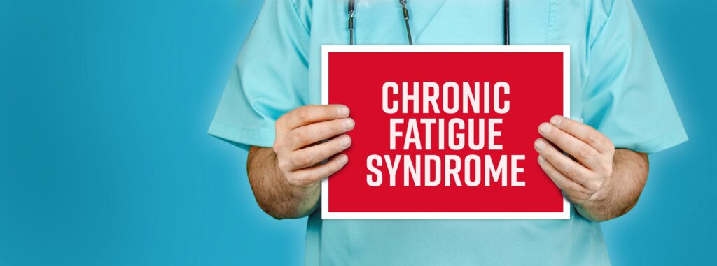 Chronic fatigue syndrome. Doctor shows red sign with medical word on it. Blue background.