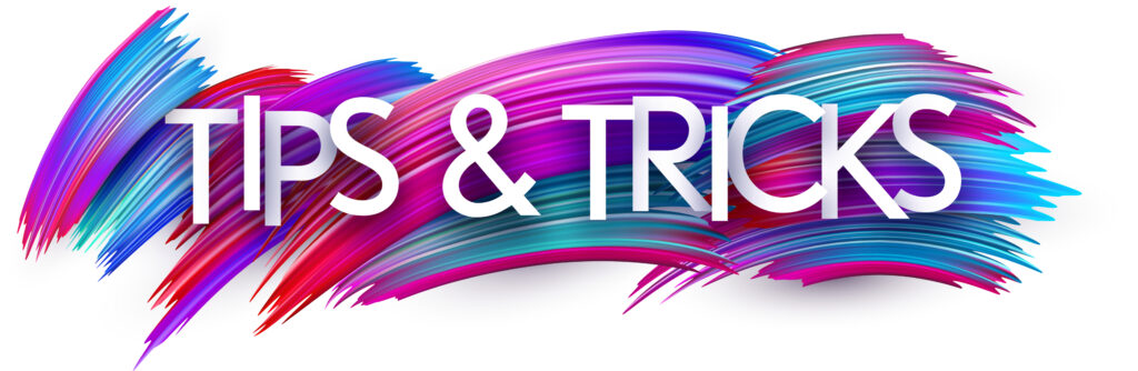 Trick questions and tips paper word sign with colorful spectrum paint brush strokes over white.