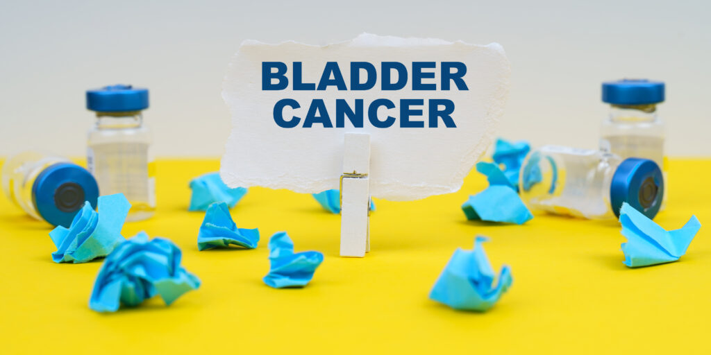 Bladder cancer - Medicine and health concept. On a yellow background are ampoules, blue crumpled paper and paper with the inscription - bladder cancer