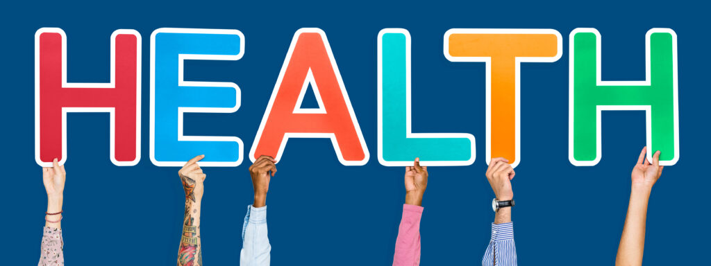 Diverse hands holding the word health, prevent disability 